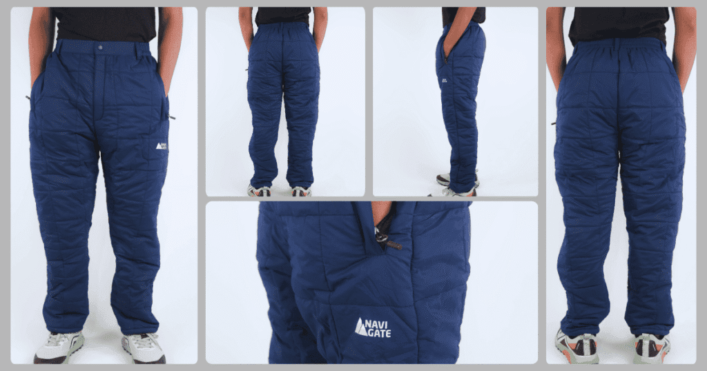 Man wearing navy blue Prima Loft insulated winter trousers standing against a white background